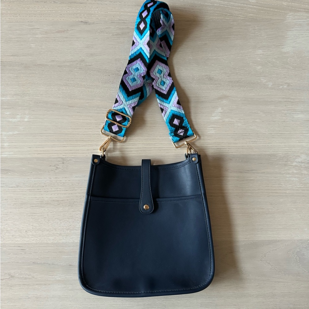 Navy leather saddle bag with embroidered strap